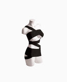 mannequin with black bondage tape wrapped across the bodice