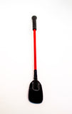 Closeup of black bdsm crop with red shaft and leather-look, thin and rounded tip crop