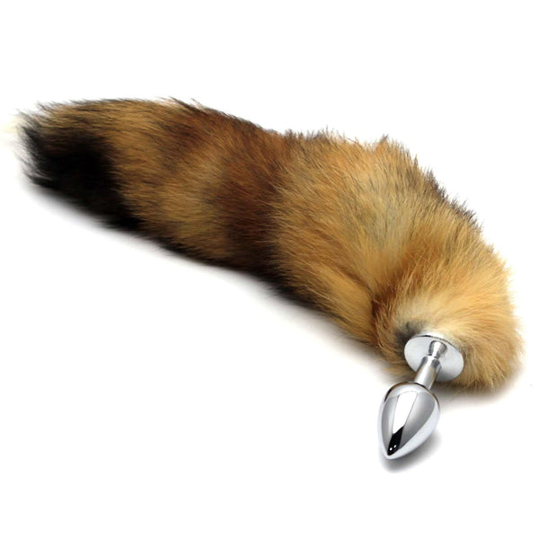 Redish brown ombre faux fur fox tail and butt plug. The vegan fur tail is connected to a base, making it safe for anal play.